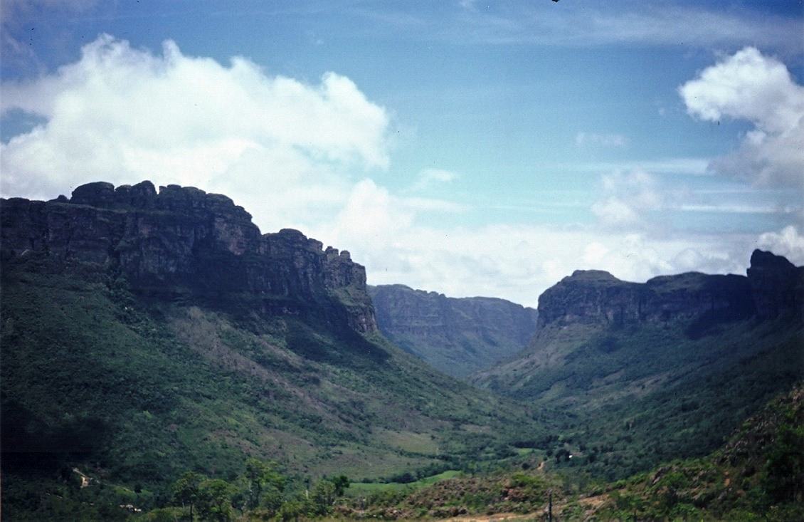 Chapada Diamantina, a green valley between cliff topped mesas
