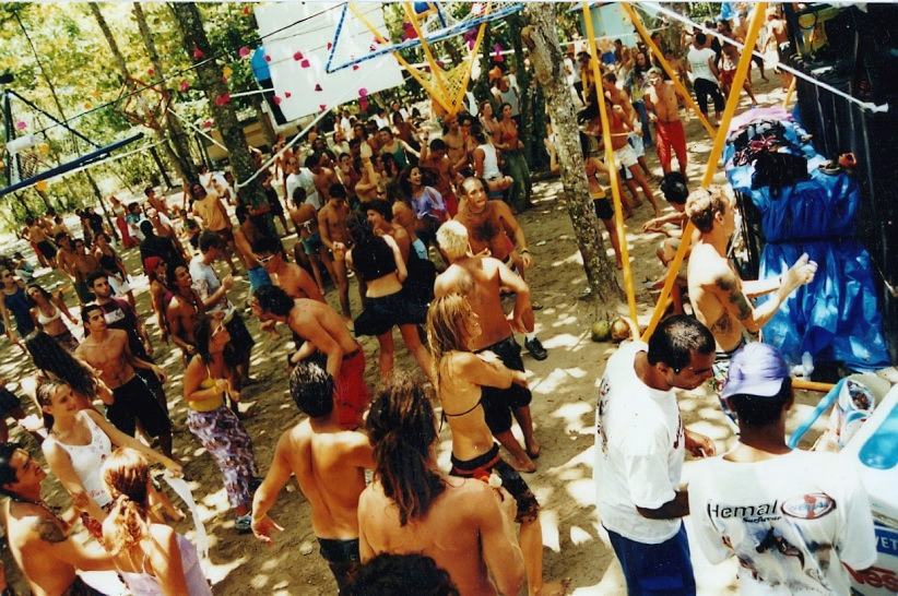 a crowd of dancers on a sandy dance floor