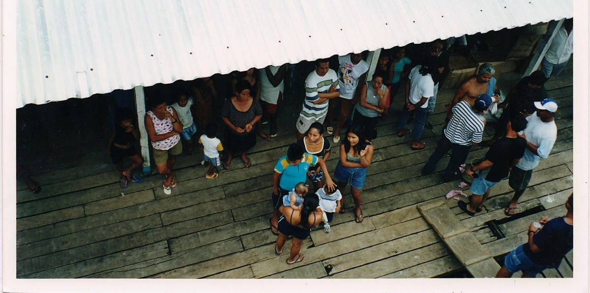 a crowd on a plank dock, seen from above