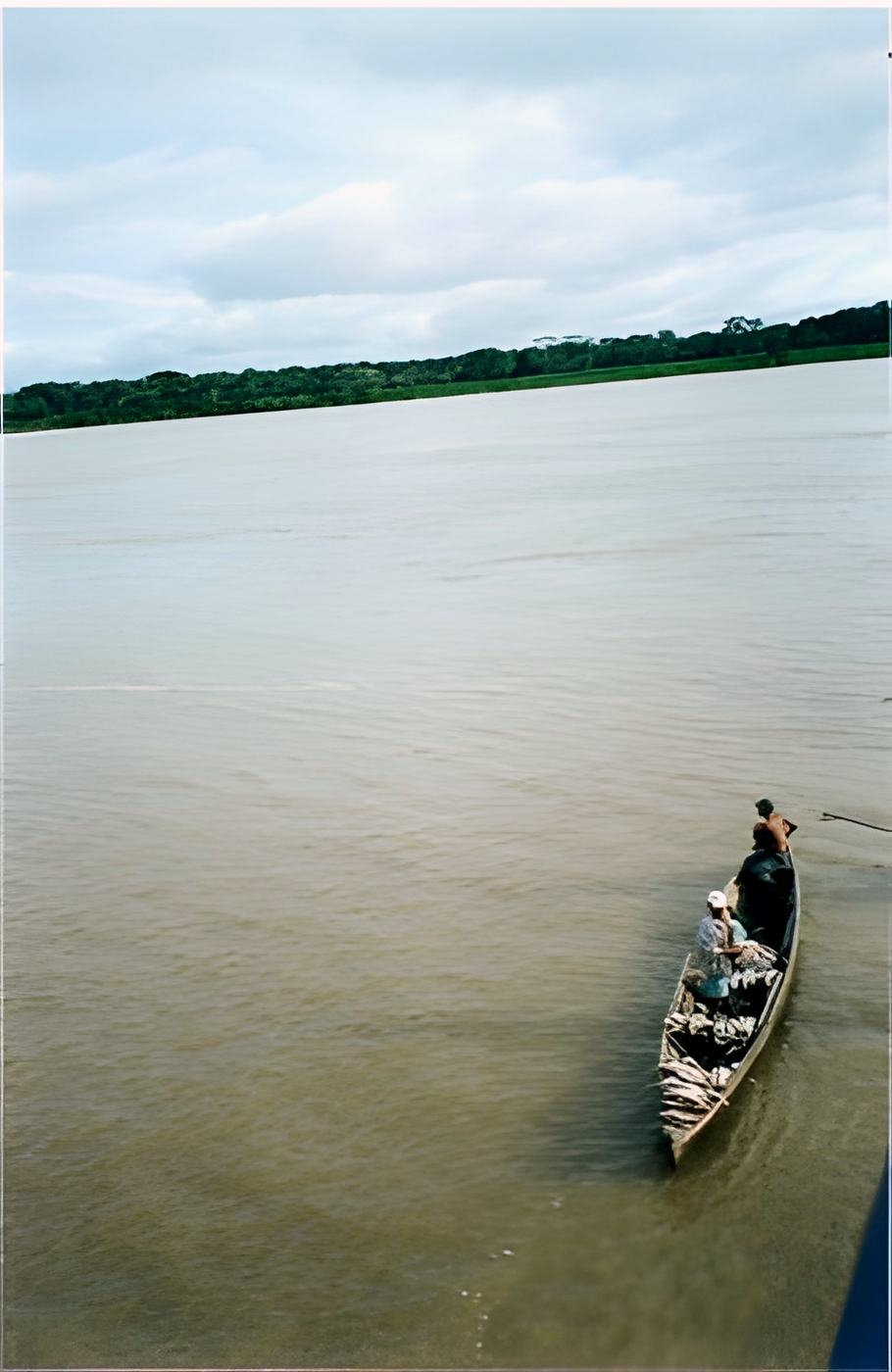 a loaded canoe with two people, seen from above