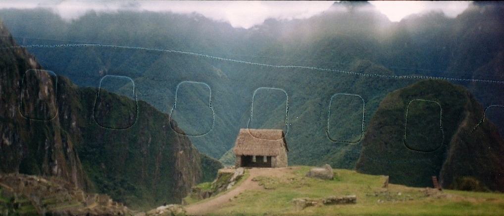 Machu Picchu, a stone hut on a misty ridge