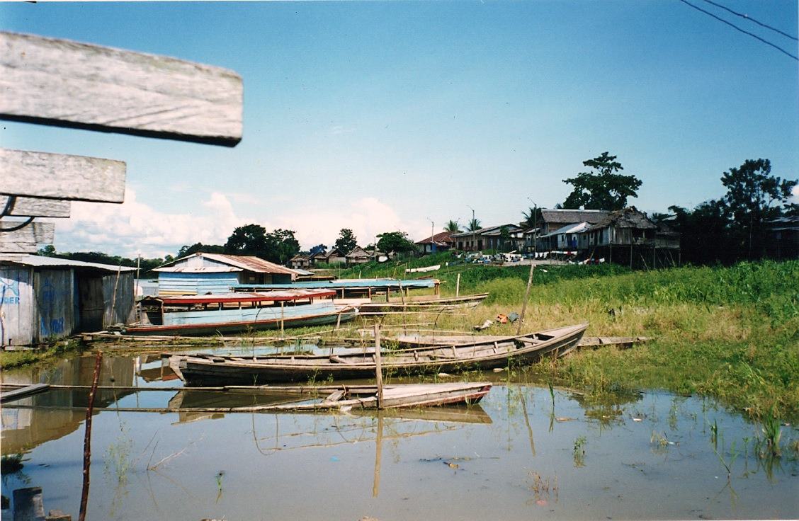 in the leper village in the Amazon, canoes moored in a backwater